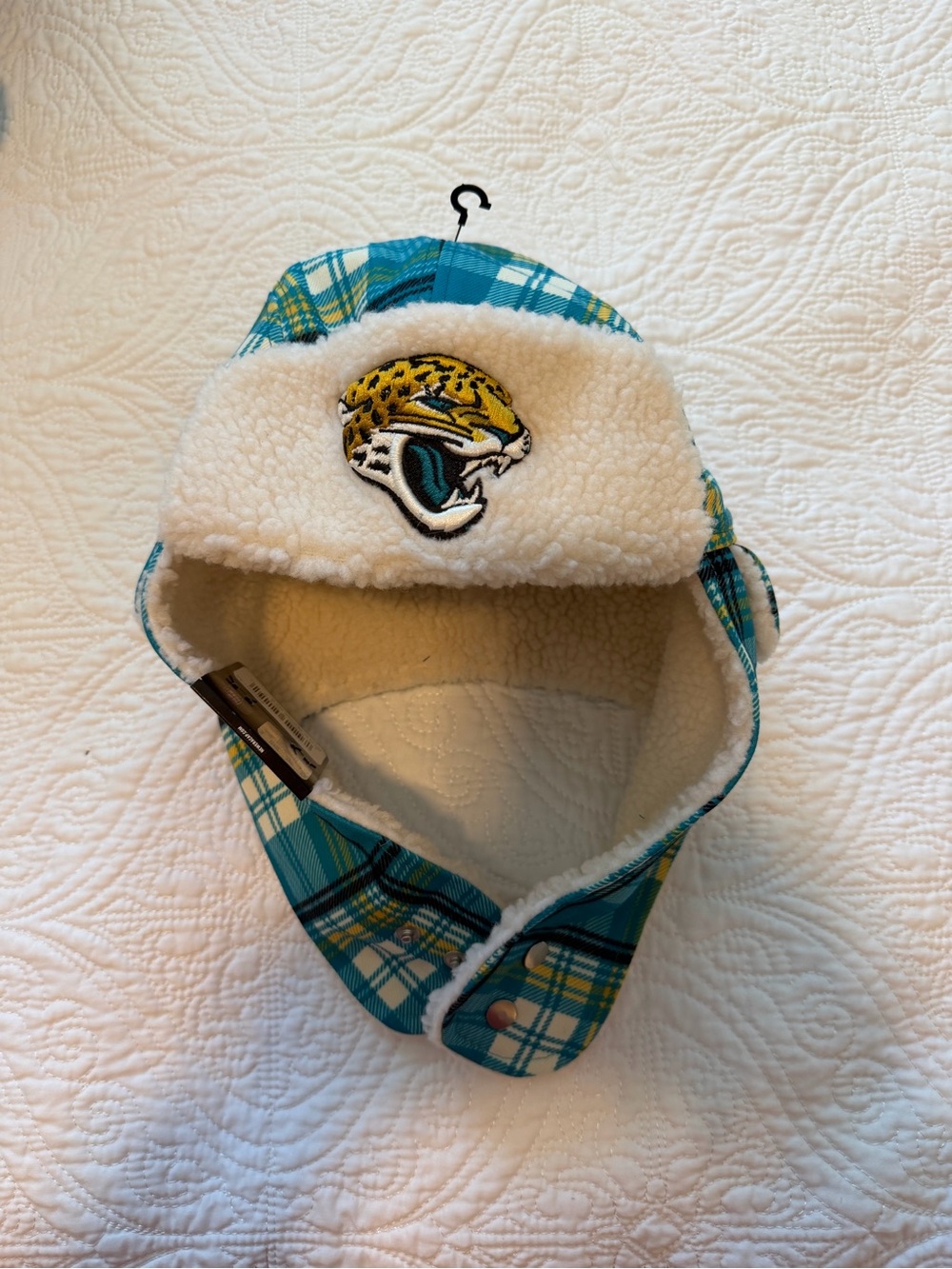 NFL Teal Plaid Sherpa Trapper Hat with Jacksonville Jaguars Logo
